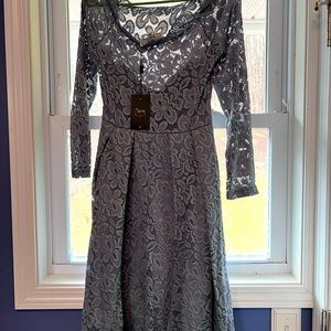 Stunning lace dress that sits slightly off the shoulders. Brand new with tags!